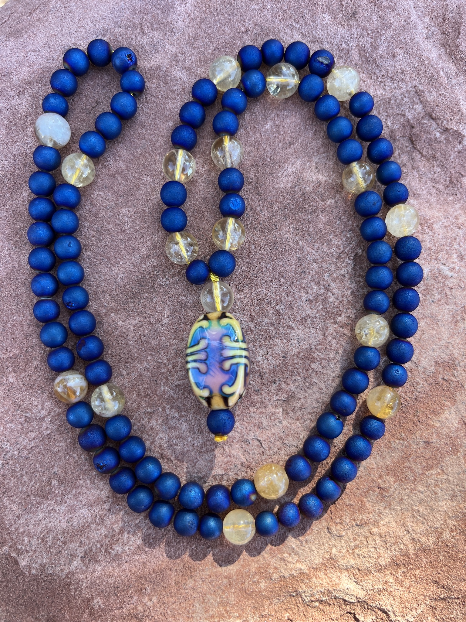 “Khumbu Memories” Druzy, Citrine Accents, ‘Fleur-de-Lis’ Mirage Pendant "Khumbu Memories" Druzy, Citrine Accents, 'Fleur-de-Lis' Mirage Pendant